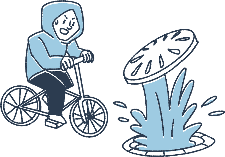 自転車で水たまりのそばを走る人のイラスト